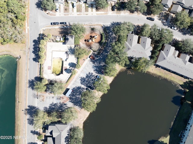 birds eye view of property featuring a water view