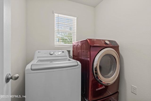 washroom featuring washer and dryer