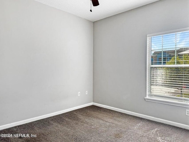 spare room with carpet floors and ceiling fan