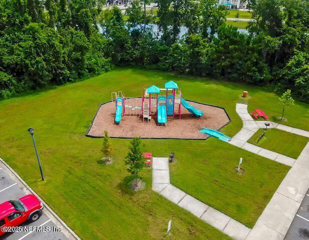 view of jungle gym featuring a yard