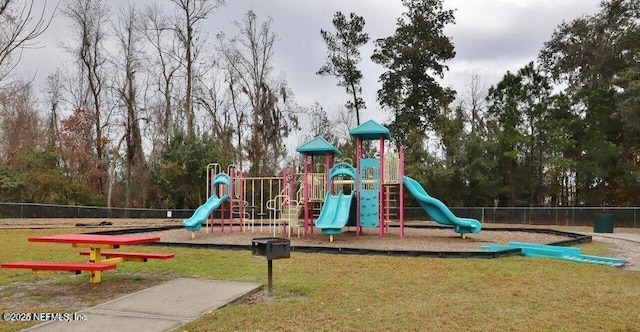 view of jungle gym with a lawn