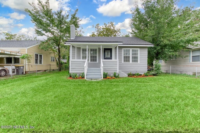 exterior space with a porch and a front yard