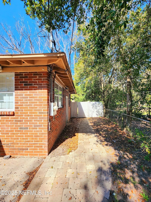 view of property exterior featuring a patio