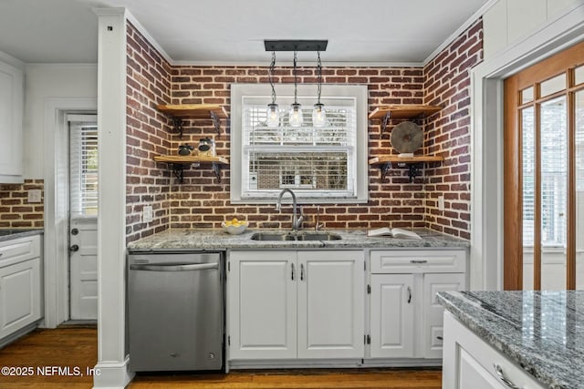 kitchen with white cabinetry, stainless steel dishwasher, decorative light fixtures, and sink