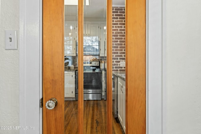 hall featuring dark wood-type flooring