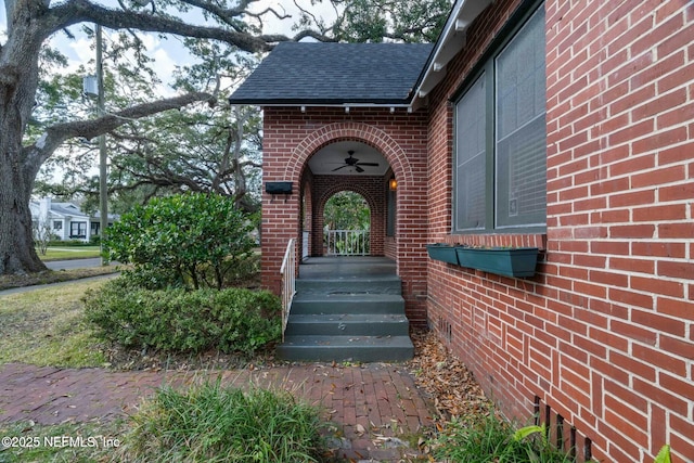 doorway to property featuring ceiling fan