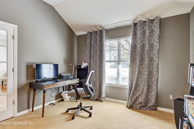 home office featuring a wealth of natural light, baseboards, and vaulted ceiling