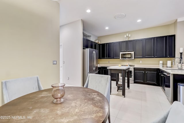 dining room featuring light tile patterned flooring and recessed lighting