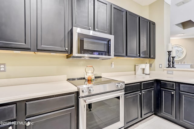 kitchen with visible vents, appliances with stainless steel finishes, and light countertops