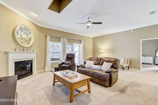 living room with visible vents, carpet, a ceiling fan, and crown molding