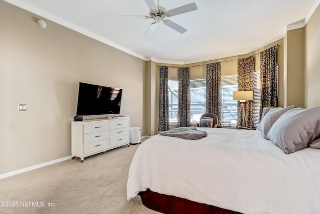 bedroom with baseboards, light carpet, ceiling fan, and crown molding