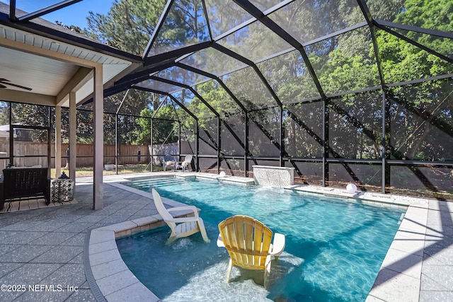 view of swimming pool featuring a patio, a fenced backyard, and a lanai