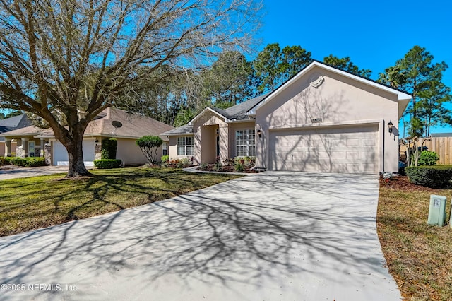 ranch-style home with concrete driveway, an attached garage, a front lawn, and stucco siding