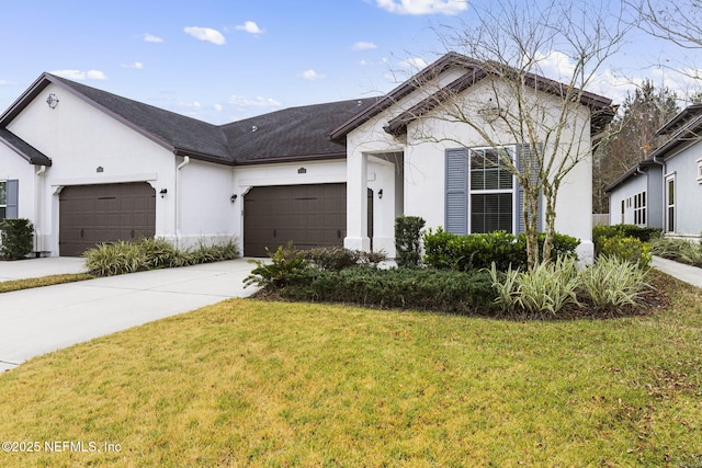 view of front of property with a garage and a front lawn