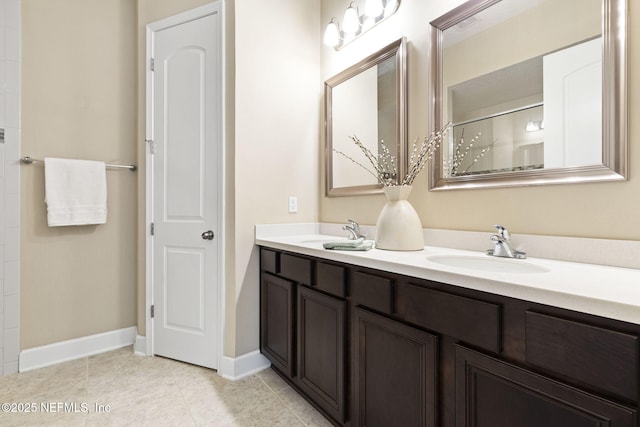 bathroom with vanity and tile patterned flooring