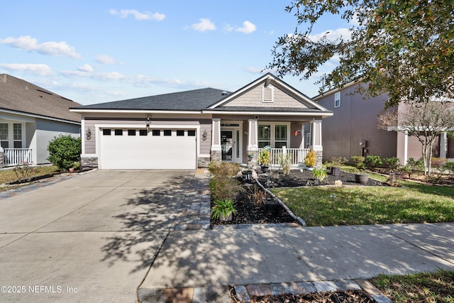 view of front of property featuring a garage and a porch