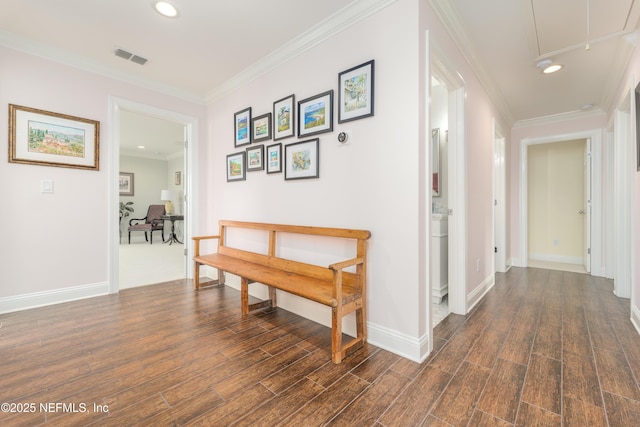 corridor with ornamental molding and dark hardwood / wood-style floors