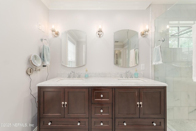 bathroom featuring crown molding, vanity, and an enclosed shower