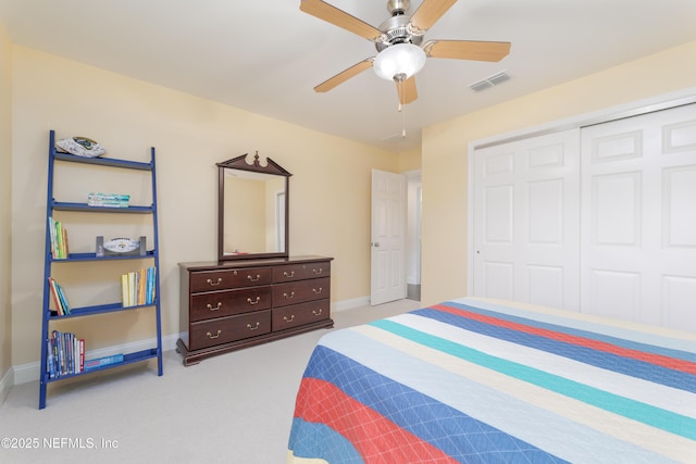 bedroom with light carpet, a closet, and ceiling fan