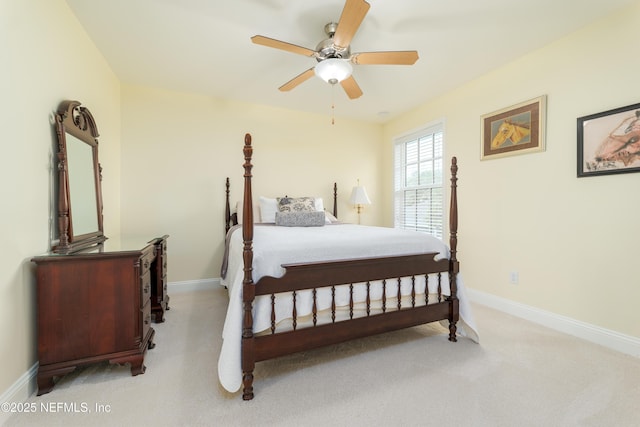 bedroom featuring light carpet and ceiling fan