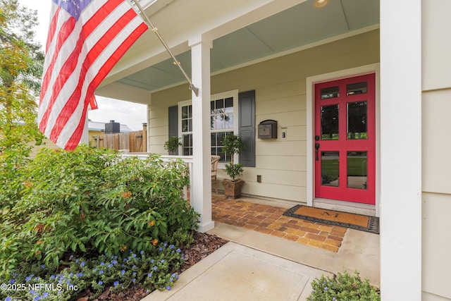 doorway to property featuring a porch