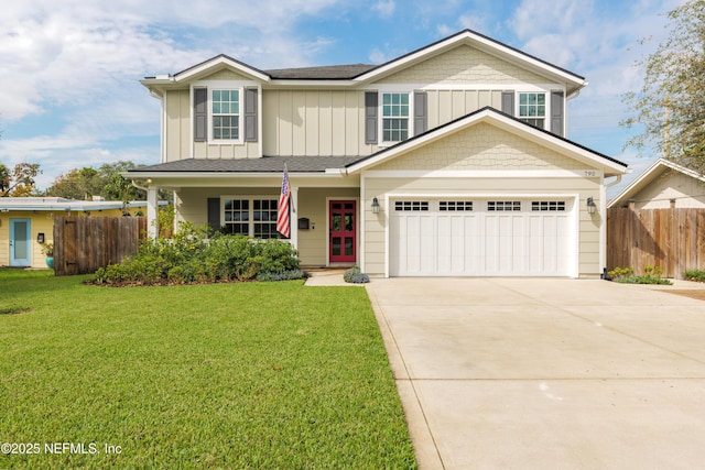 view of front of house featuring a garage and a front yard