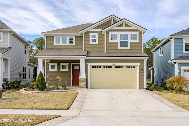 craftsman-style house with a garage and a front yard