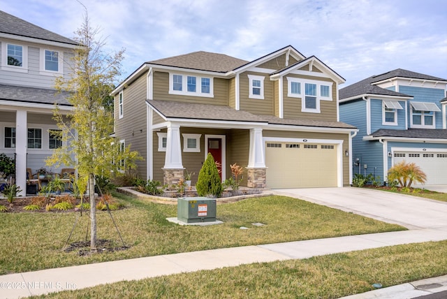 craftsman inspired home featuring a garage and a front lawn