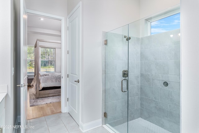 bathroom featuring walk in shower and tile patterned floors