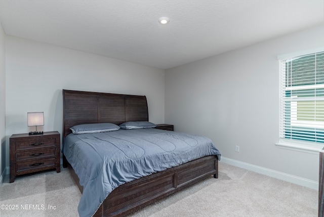 bedroom featuring light colored carpet