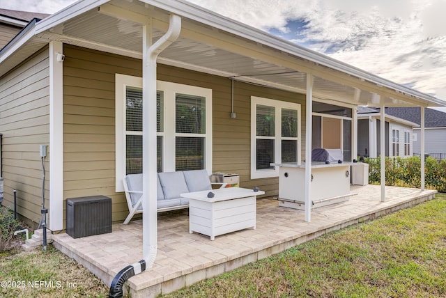 back of house with an outdoor hangout area and a patio