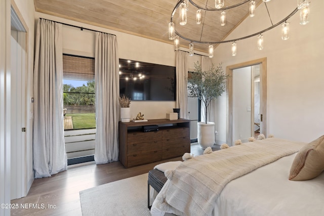 bedroom with wood ceiling, vaulted ceiling, and wood finished floors