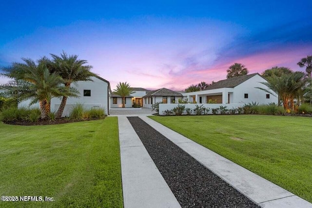 view of front of property with a front lawn