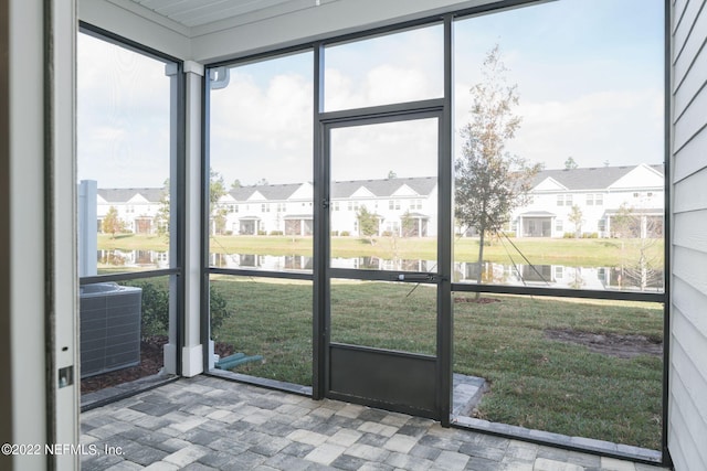 doorway to outside featuring a water view