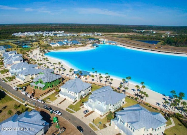 aerial view with a view of the beach and a water view