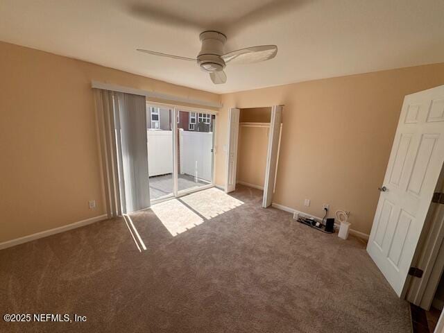 unfurnished bedroom with access to exterior, carpet floors, and ceiling fan