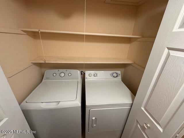 laundry area featuring washing machine and clothes dryer