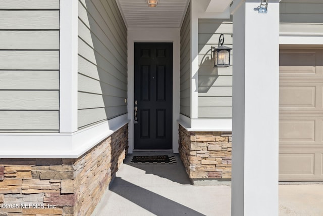 property entrance featuring a garage