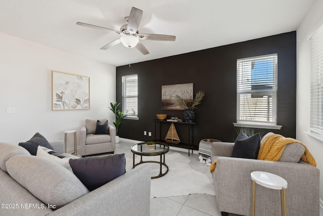 tiled living room with ceiling fan