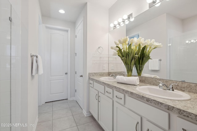 bathroom featuring vanity, an enclosed shower, and tile patterned flooring