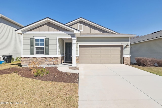 craftsman inspired home with a garage and a front yard