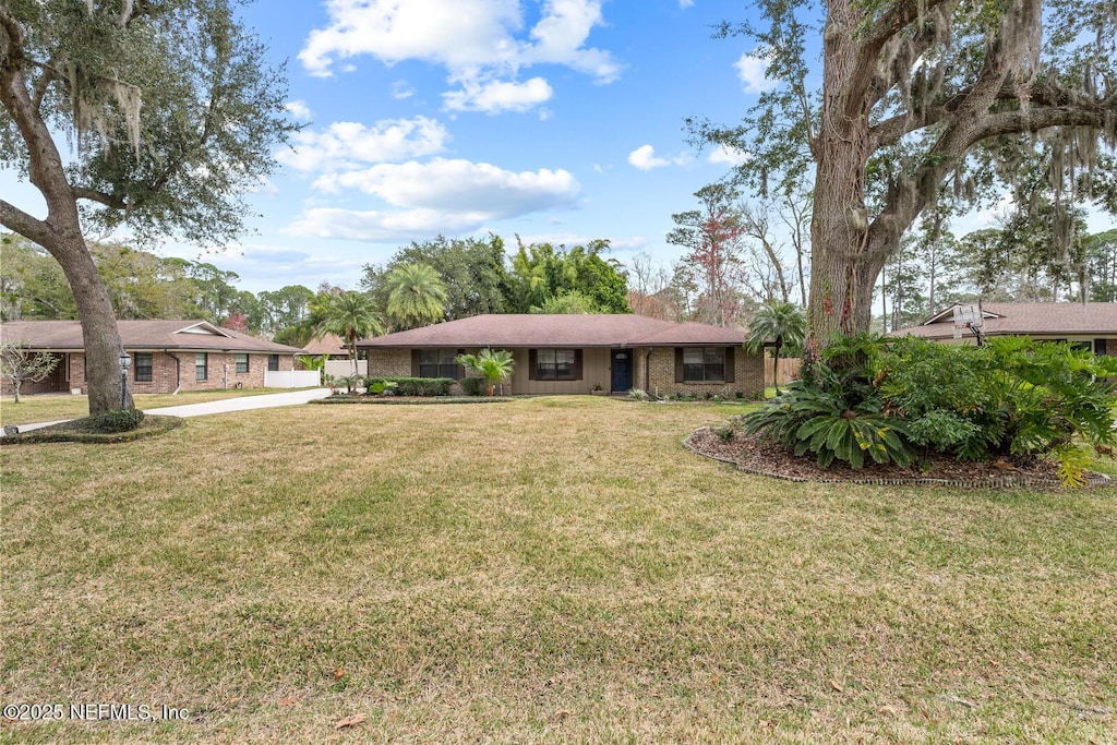 ranch-style house with a front yard