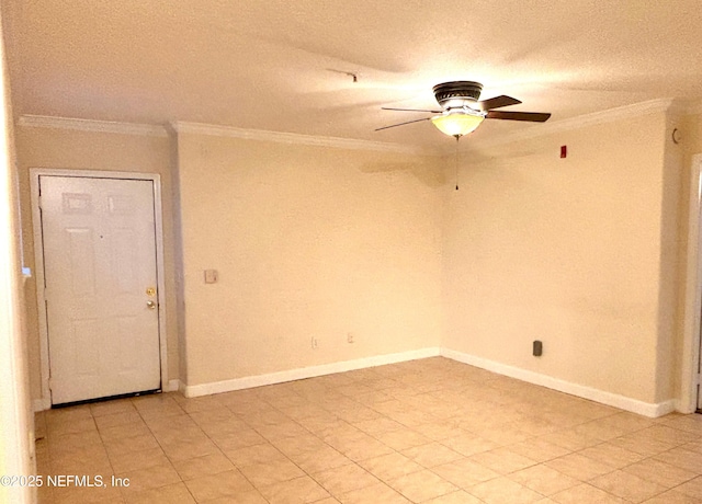 spare room featuring ornamental molding and ceiling fan