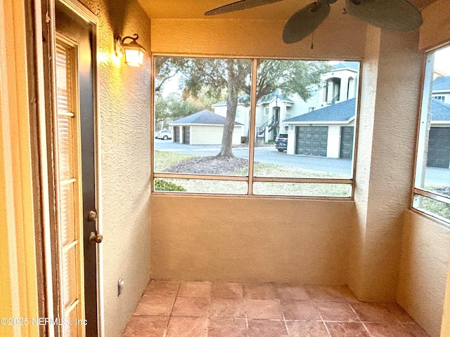 unfurnished sunroom featuring plenty of natural light