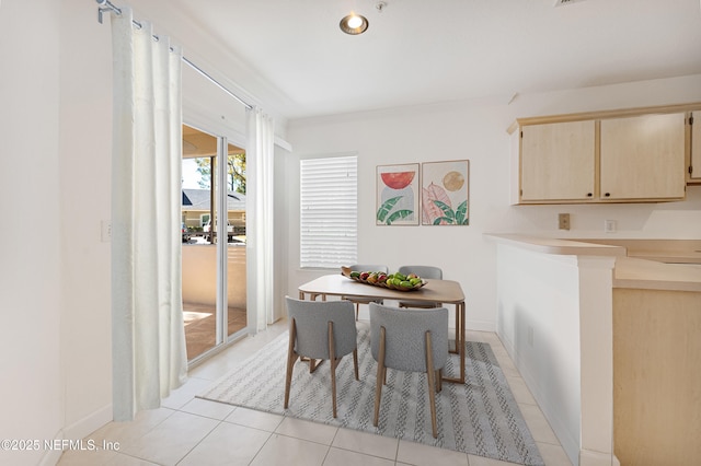 dining space with light tile patterned floors