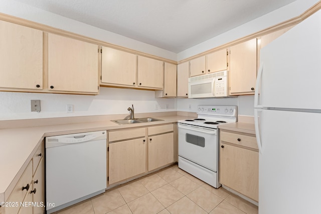 kitchen with light tile patterned floors, light brown cabinets, white appliances, a sink, and light countertops