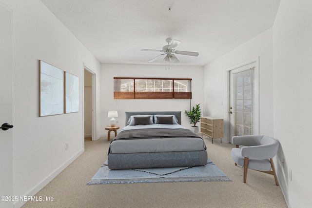 bedroom featuring a ceiling fan, baseboards, and carpet flooring