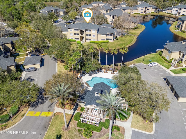 bird's eye view with a water view and a residential view