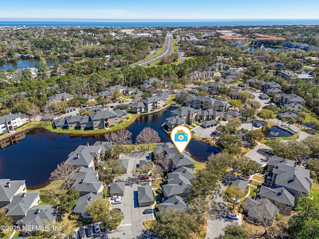 aerial view with a water view and a residential view