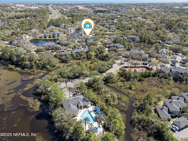 bird's eye view featuring a water view and a residential view